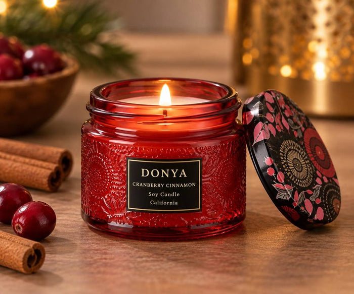 DONYA Cranberry Cinnamon holiday soy candle in a red jar